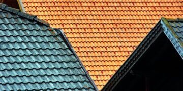 Choosing The Right Roofing Material for Your Business If you're a business owner, one of your top priorities is making sure your building is safe and protected from the elements. A new roof is a big investment, so it's important to choose the right material for your needs. There are a variety of roofing materials available on the market today, each with its own advantages and disadvantages. Let's explore your options! Different Types of Roofing Materials The most common types of roofing materials are asphalt shingle, metal, tile, and slate. Each material has its own unique benefits, so it's important to consider all the available options before making a decision. Asphalt Shingles: Asphalt shingles are one of the most popular choices for commercial buildings. They are durable and relatively inexpensive to install; also, they can be customized with different colors, textures, and shapes. However, they don't last as long as some other materials and may need to be replaced every 15-20 years. Metal: Metal roofing is an excellent option for commercial buildings because it's extremely durable. What's more, it's also fire-resistant and can last up to 50 years. However, it is more expensive than asphalt shingles, and installation requires specialized skills. Tile: Tile roofing is a good option for businesses that want a classic look. They are aesthetically pleasing and can also protect from UV rays. Sadly, the downside is that they require regular maintenance and repair. Slate: Next, slate roofing is another classic choice for commercial buildings. While it may be more expensive than other roofing options, it can last up to 100 years if properly maintained. Of course, we should also mention solar panels. Solar energy is becoming more popular and is an increasingly cost-effective way to power businesses. This type of roofing can help you save money on your energy bills while helping the environment. Considerations When Choosing a New Roof for Your Business Now that you’ve seen some of the most popular roofing materials, let’s look at a few of the considerations to help you choose the best material for your business. If you still have no idea after reading through this section, contact a roofing contractor in Phoenix for assistance. Climate: Many areas of the country have different climates and weather patterns. To ensure your roof is durable, it's important to choose a material based on the climate in your area. For example, metal roofing may be ideal for hotter climates with more sun exposure, as it reflects sunlight and helps keep the building cooler. Meanwhile, asphalt shingle is better suited for more temperate climates, as it offers more insulation. Weight: Furthermore, different materials also have different weights. If you're looking for something lightweight that won't cause structural strain on your building, materials like asphalt shingles and composite roofing may be the best options for you. On the other hand, if your building can handle heavy material, slate or tile may be the best choice. Durability: Additionally, you should also consider how durable you need your roofing to be. If you're looking for a roof that can withstand extreme weather conditions and last for decades, metal roofing is the best choice. Maintenance: Inspections are always wise with roofing materials, but some require more frequent maintenance than others. Asphalt shingles and composite materials generally need to be inspected and resealed more frequently than metal roofing. The maintenance with metal roofing entails more cleaning and the occasional repair should something become damaged. Cost: Finally, the cost is always a factor to consider when choosing roofing materials. While asphalt shingles and composite materials are the least expensive initially, they often have to be replaced sooner than metal roofing. Roofing
